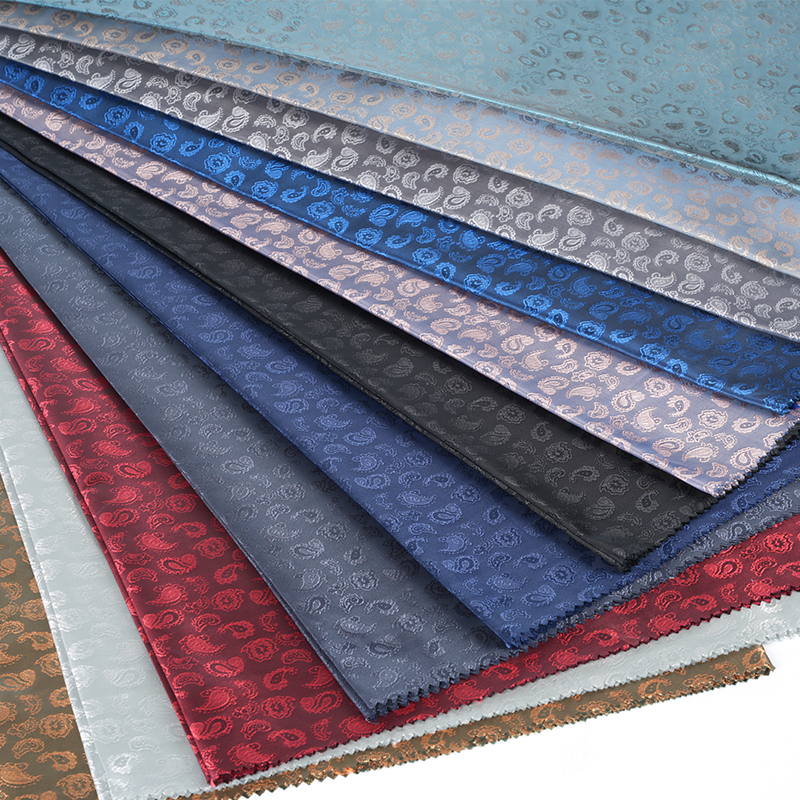 Żakard poliestrowy z kationowymi kwiatami nerkowca