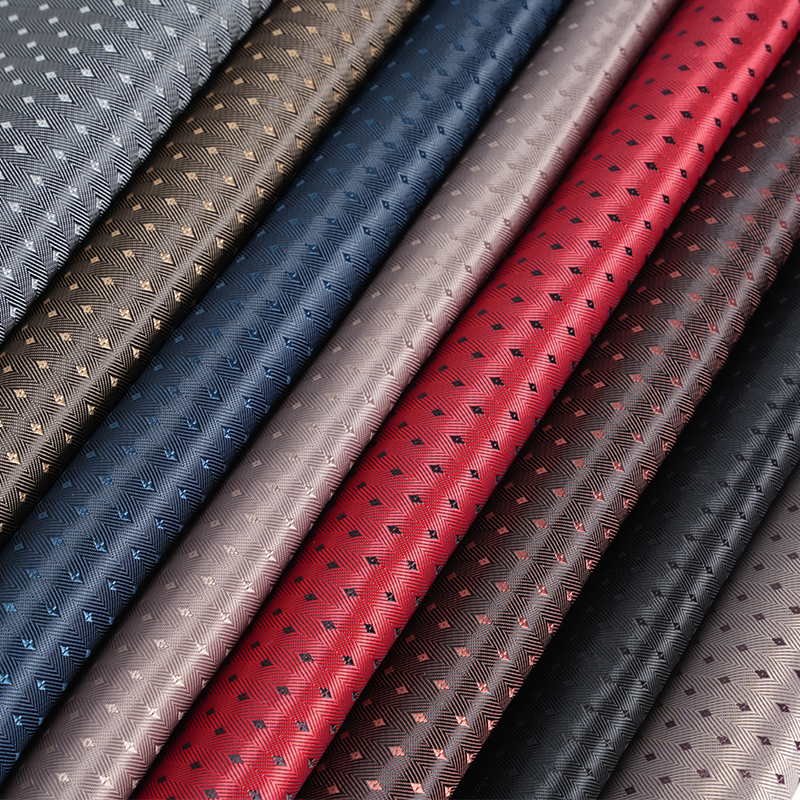 Tkanina PV w jodełkę o diagonalnym splocie, z małą siatką w kształcie rombu